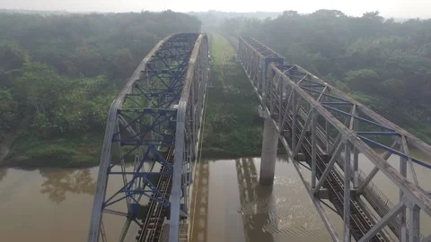 Double track railway bridge with reverse aerial movement Stock Footage 154554639