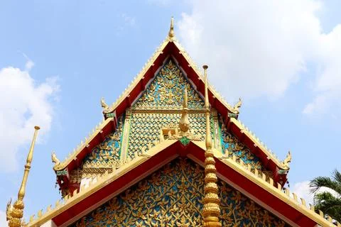 Double triangle shape of native Thai art church's gable and sky. Stock Photos
