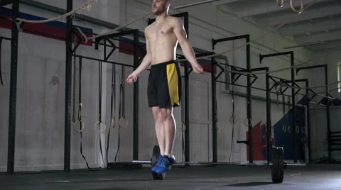 Double unders exercise - young athlete doing rope jump workout at gym Stock Footage 65279900