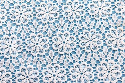 Double white-blue material with symmetrical pattern for tailoring tablecloths Stock Photos