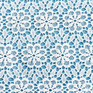 Double white-blue material with symmetrical pattern for tailoring tableclot.. Stock Photos