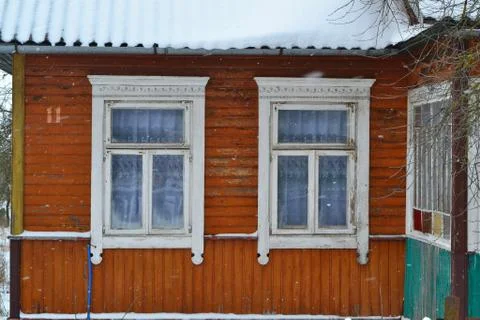 Double window frames in traditional russian village close up. Stock Photos