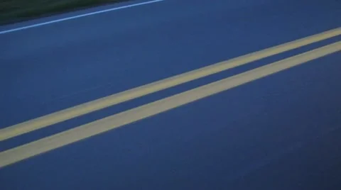 Double Yellow Lines on Road at Dusk Stock Video Stock Footage
