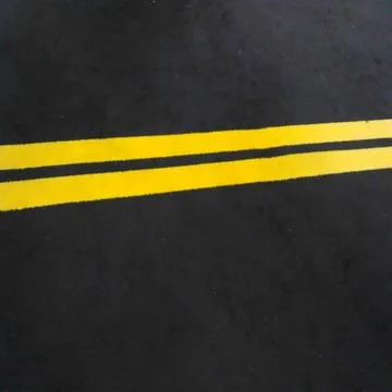 Double yellow lines on the road Stock Photos