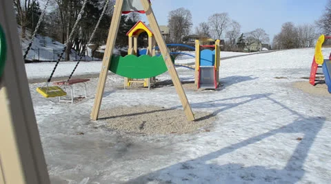 Double yellow swing rubber grip winter day childrens playground Video stock 22631152