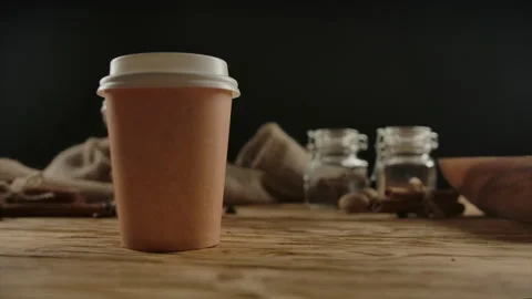 Doubling the drink. Concept for second free. Second paper cup appears after one Stock Footage 137090593