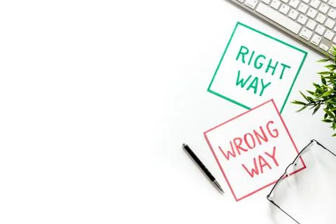 Doubt concept.. Right and wrong way icons on work desk from above copy space 스톡 사진
