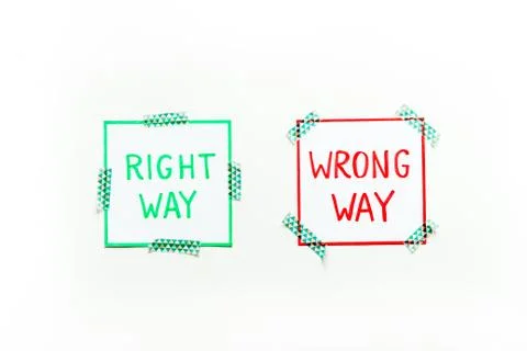 Doubt concept.. Right and wrong way icons on work desk from above 스톡 사진