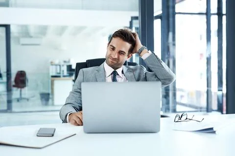 Doubt, laptop and problem solving with business man at desk in office for email Stock Photos