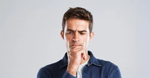 Doubt, man and thinking of solution in studio for problem solving, wondering and Stock Photos