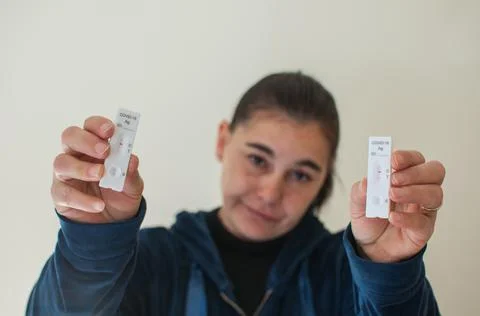 Doubtful covid-19 rapid test Stock Photos