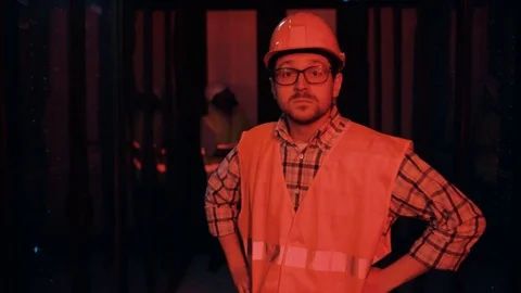 Doubtful IT technician shrugging shoulders having electricity error at database Stock Footage 120747451