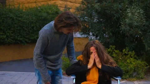 Doubts, crisis - woman using wheechiar expresses her doubts to her boyfriend Stock-Footage 166168761