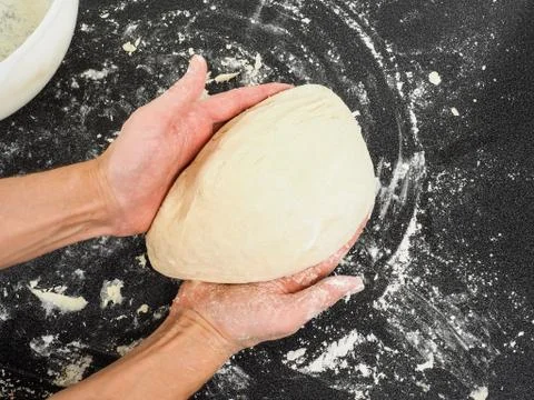 Dough after proofing in hands Stock-Fotos