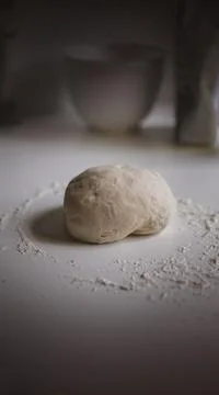 Dough and Flour on a Table, Ready to be Made to Bread Stock Photos