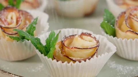 Dough and mint rosettes sprinkled with powdered sugar Stock Footage 255408052