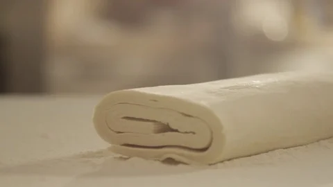 Dough and puff pastry fall on flour RAPID 100fps (FEW SHOTS) Stock Footage 74653841