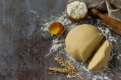 Dough, baking background. Raw dough ball for bread or pizza. Stock Photos
