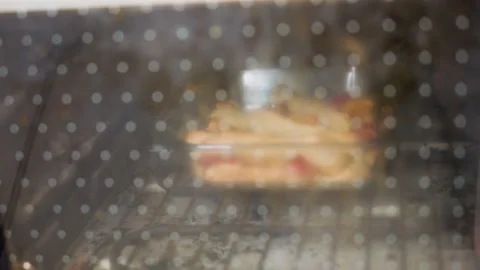 Dough Baking Behind Oven Door With Steam And Golden Crust Stock Footage 321475459