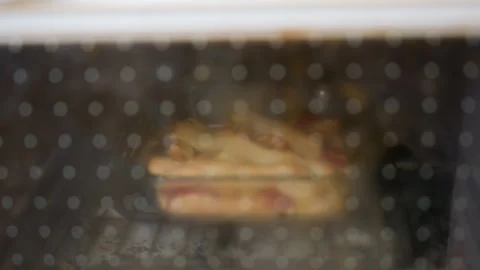 Dough Baking Behind Oven Door Closeup With Steam And Golden Crust Stock Footage 321488255