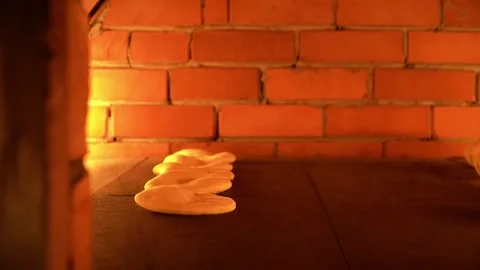 Dough Baking in a Brick Oven Stock Footage 319950209