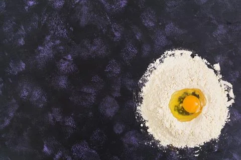 Dough for baking or pastry on dark background. Top view Stock Photos