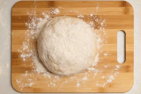 Dough ball on the Board on the kitchen table Stock Photos