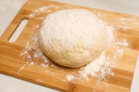 Dough ball on the Board on the kitchen table Stock-Fotos