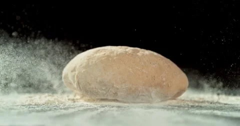 Dough Ball Dropping into Flour in Super Slow Motion at 1000 fps. Stock Footage 328705169