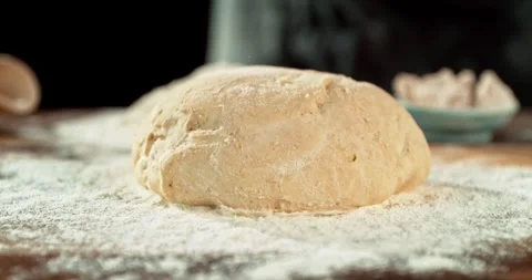 Dough Ball Dropping into Flour in Super Slow Motion at 1000 fps. Stock Footage 328705170