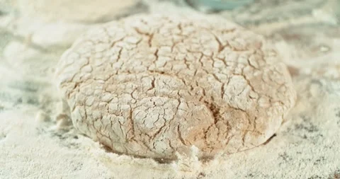 Dough Ball Dropping into Flour in Super Slow Motion at 1000 fps. Stock Footage 328705176
