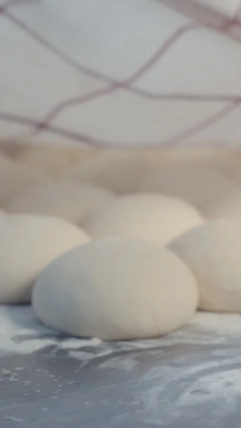 Dough Balls Covered with Kitchen Towel Stock Footage 344393152