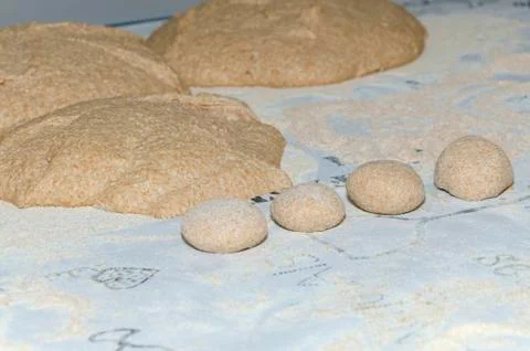 Dough balls from Einkorn wheat on a table in a bakery Stock Photos