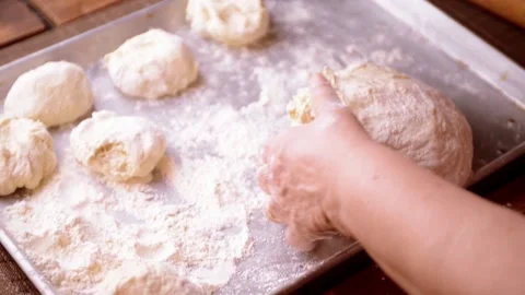 Dough being cut and divided by hand 스톡 동영상 149283438