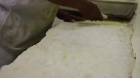 Dough being cut and moved Stock Footage 9464174