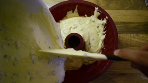 Dough is being filled into baking pan Stock-Footage 78564073