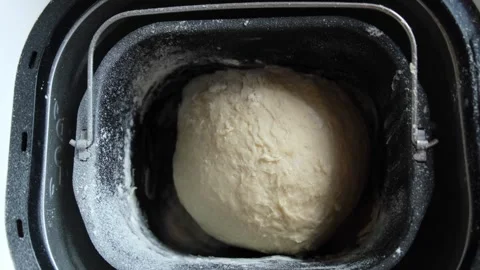 Dough being kneaded in a bread maker, close-up Stock Footage 317149698
