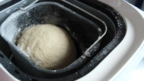 Dough being kneaded in a bread maker, close-up Stock Footage 317259344