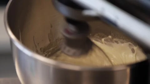 Dough being mixed with a blender Stock Footage 307339926