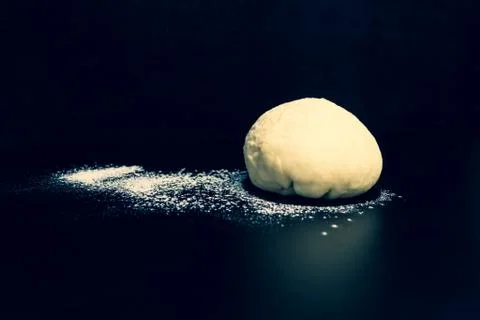 Dough on a black background close up Stock Photos