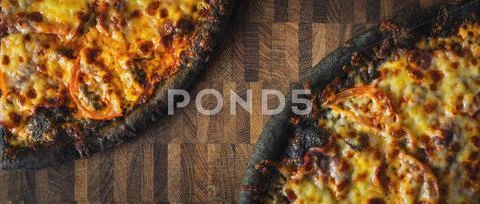 Dough black pizza on the wooden table wide screen Stock Photos