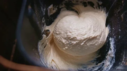 Dough in bread-maker pan mixing. Stock Footage 136430254