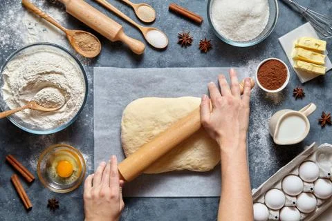Dough bread, pizza or pie recipe preparation. Female baker hands rolling with Stock Photos