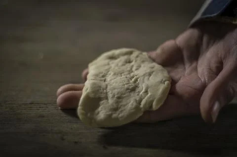 Dough for campfire bread on hand. The basic dough is made of flour, yeast, water Stock Photos
