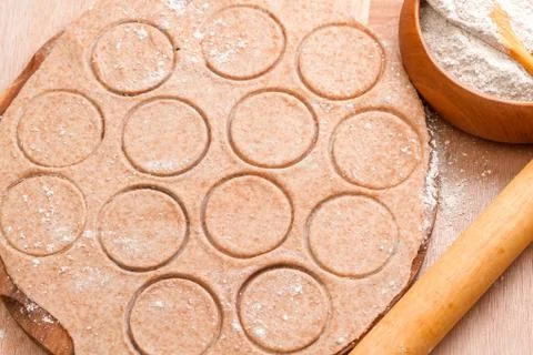 Dough circle ready to prepare  Italian tortellini. Step on step recipe warmin Foto stock