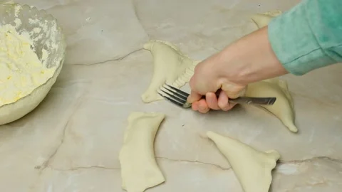 Dough with cottage cheese for baking buns pie, wrapping cheese with fork Stock Footage 167300447