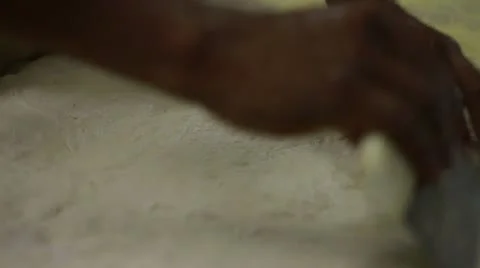 Dough CU diff angle cutting and moving Stock Footage 9461851