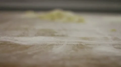 Dough CU flour dropping Stock Footage 9458744