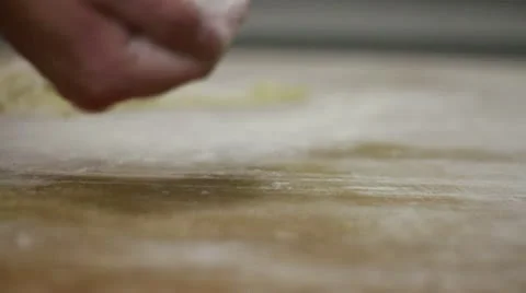 Dough CU hand flour drizzle Stock Footage 9458236