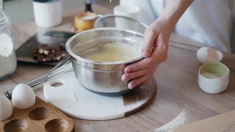 Dough dripping from a spoon Stock Footage 164381172